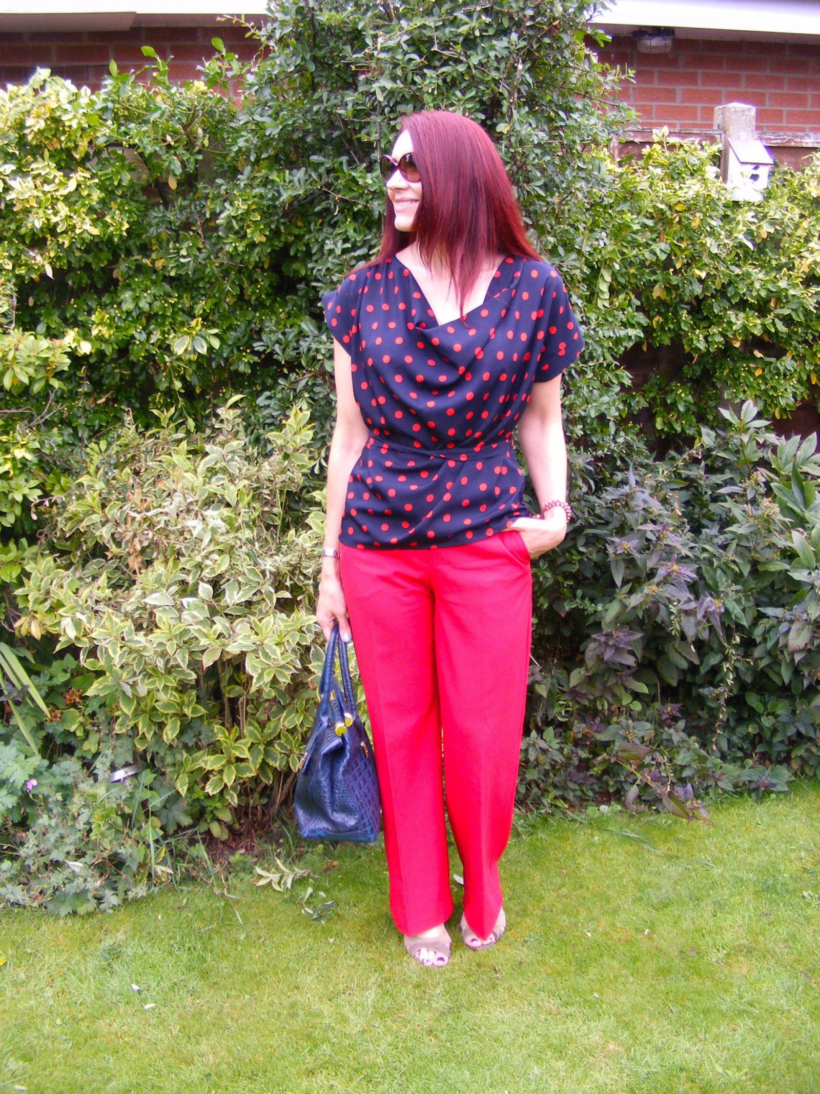 Dorothy Perkins spot top and Oasis red trousers