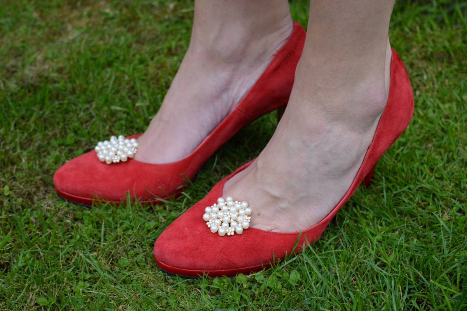 red suede shoes with shoe clips