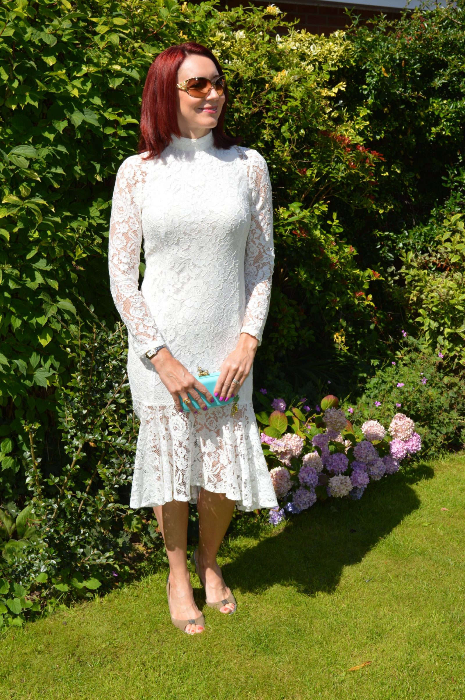 Wedding Guest Dresses From PrettyLittleThing Ellina white lace fishtail dress Anna Dello Russo H&M clutch bag
