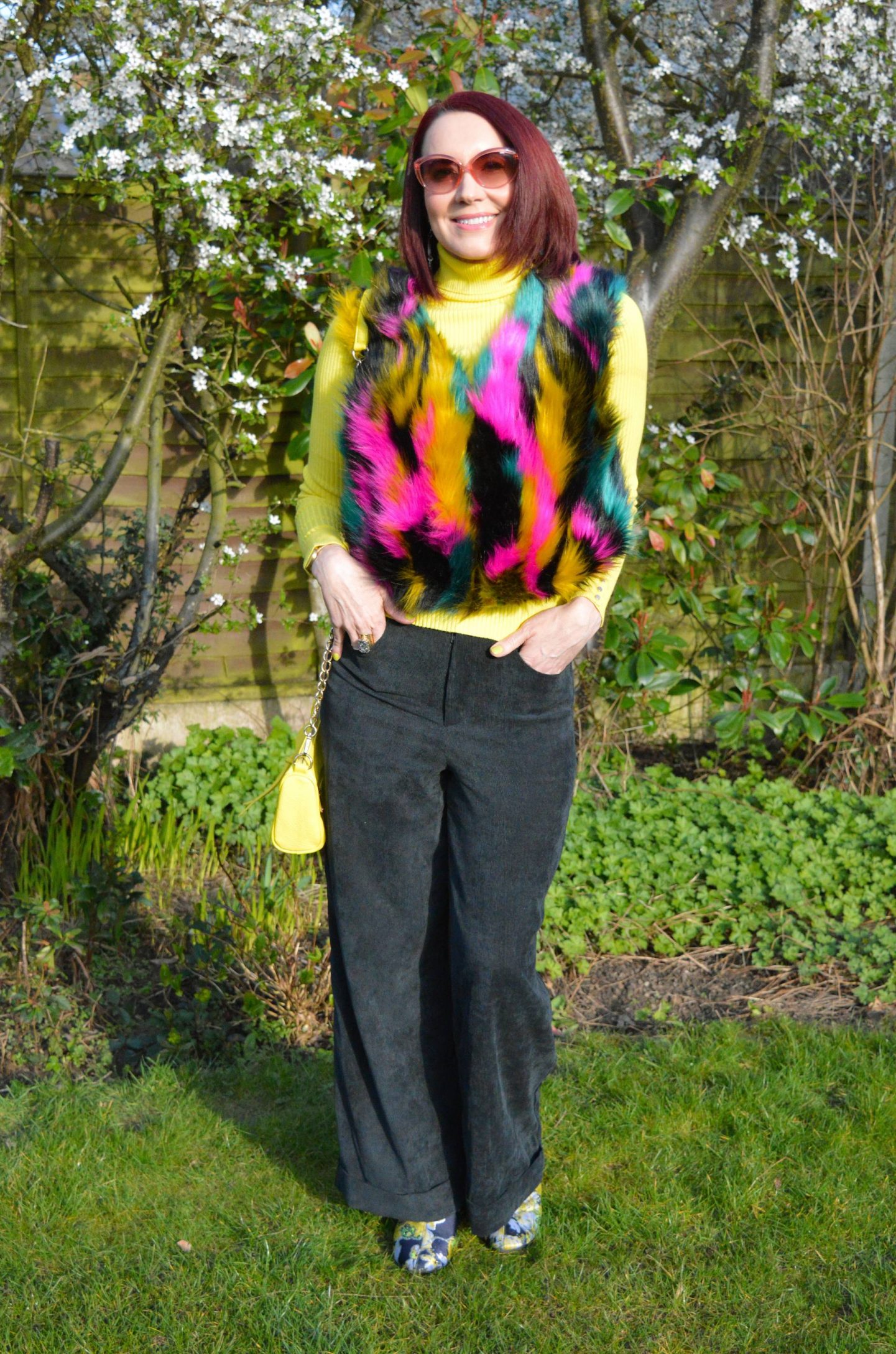 Multicoloured Faux Fur Gilet, yellow ribbed roll neck jumper, Coast baby cord black trousers