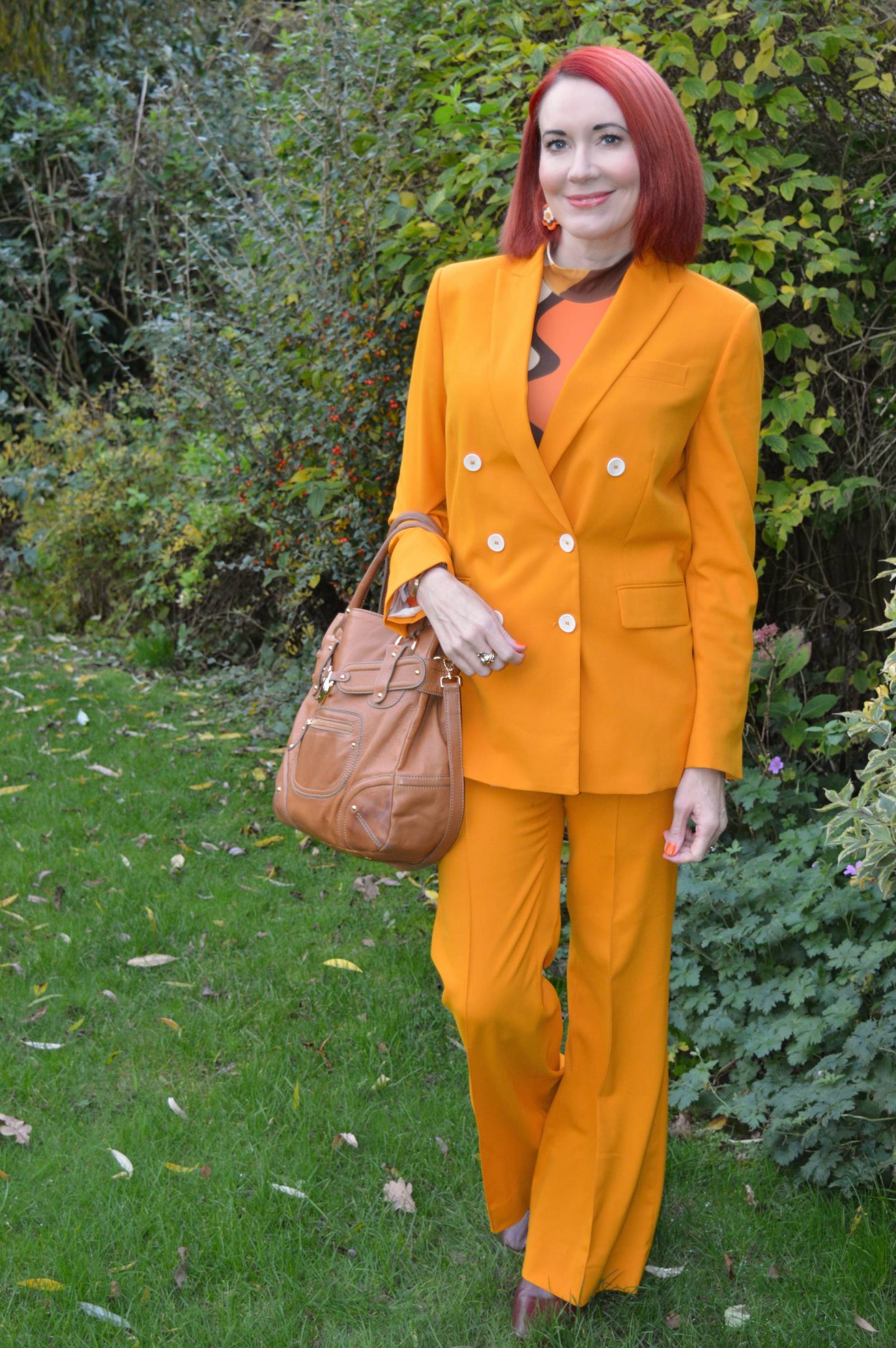 Orange Suit and Retro Print Top, Zara marigold orange suit, The Chain Designs Sharon top in Boogie Stripes, Ri2K brown bag