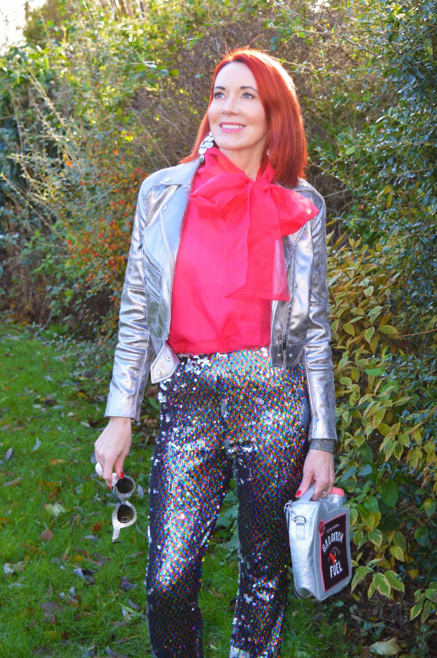 Fabulous Festive Holiday Outfits, Topshop sequin trousers, H&M silver biker jacket, Skinny Dip Bad Bitch Fuel bag